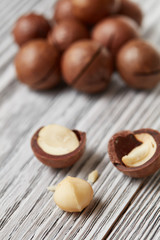 ripe macadamia nuts on a wooden table