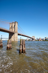 Brooklyn Bridge over East River on a sunny day, New York City, USA.