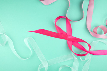 Multicolored ribbons on a green background.