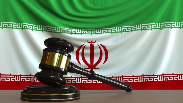 Judge's gavel and block against the flag of Iran. Iranian court conceptual animation