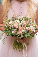 gorgeous rustic wedding bouquet of various flowers and herbs