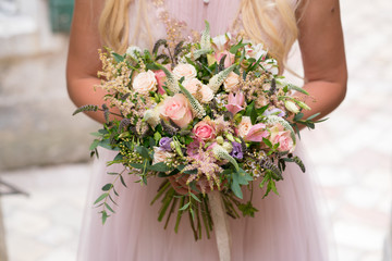 gorgeous rustic wedding bouquet of various flowers and herbs