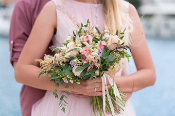 gorgeous rustic wedding bouquet of various flowers and herbs