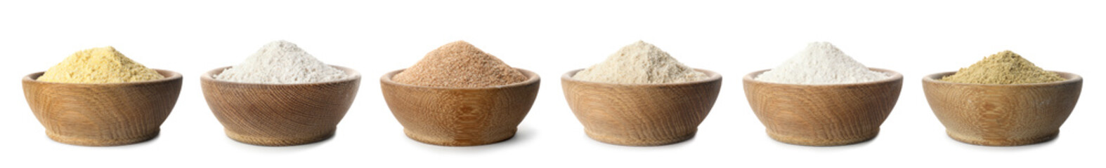 Set of organic flour in wooden bowls on white background