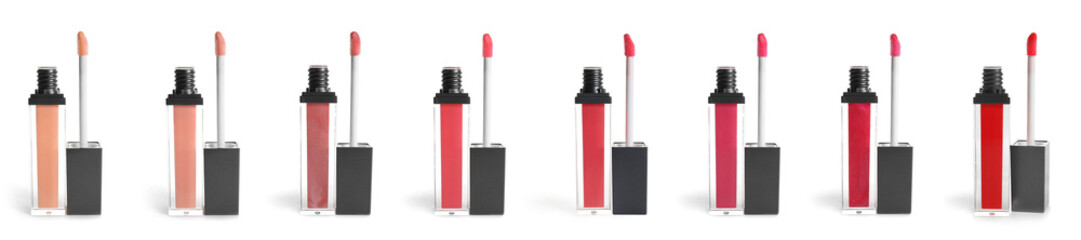 Set of liquid lipstick tubes and applicators on white background