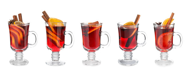 Set of traditional Christmas mulled wine in glasses on white background