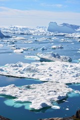 Ilulissat, Greenland, July | UNESCO world heritage site | impressions of Jakobshavn | Disko Bay Kangia Icefjord | huge icebergs in the blue sea on a sunny day | climate change - global warming