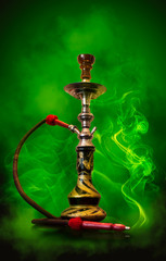 Obraz na płótnie Canvas Background of smoking hookah, green smoke, neon light