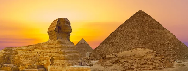 Foto op Canvas Sphinx against the backdrop of the great Egyptian pyramids. Africa, Giza Plateau. © Mountains Hunter