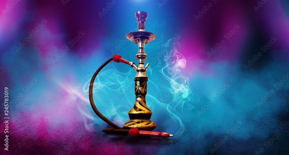 Poster smoking hookah on the background of an empty room. multicolored neon light. searchlight, laser blue 