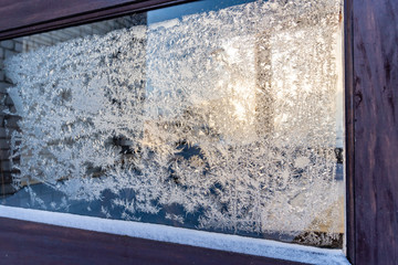 Closeup Photo of Details in Hoarfrost on Window on a Sunny Winter Day - Abstract Background