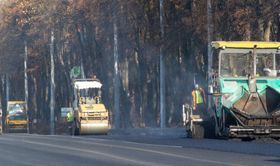 View on the road rollers working on the new road construction site