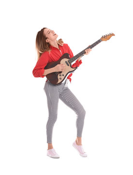 Young woman playing electric guitar on white background