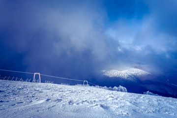 Landscape of snow mountains, lift and fence in 3-5 Pigadia, Naoussa, Greece.