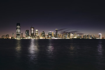 Fototapeta na wymiar New Jersey panorama at night, color toning applied, USA.