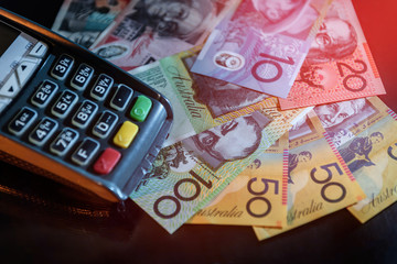 Australian dollar banknotes with terminal at black