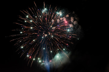 Amazing colorful fireworks on a night sky black background