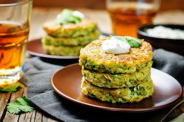 Zucchini ricotta cilantro fritters with fresh cilantro leaves