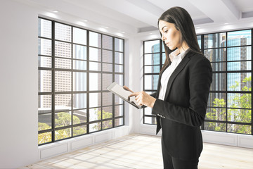 Focused businesswoman using tablet