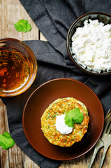Zucchini ricotta cilantro fritters with fresh cilantro leaves