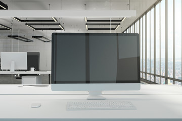 Blank computer in modern office