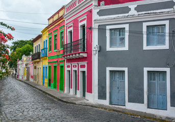 The historic architecture of Olinda in Pernambuco, Brazil with its colonial buildings and cobblestone streets at sunset.