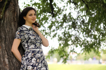 Fototapeta premium Beautiful girl in dresses for a walk