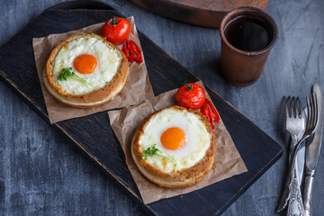 Buns with melted cheese and yolks, dark photo