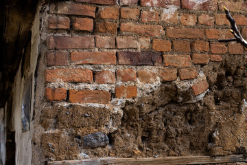 Old destroyed brick house wall