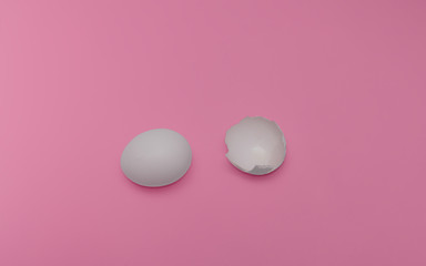concept of whole egg, yolk hidden under the shell and broken egg without yolk on an isolated background