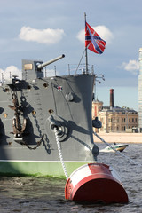 The warship anchored on the embankment of the city