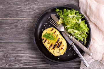 Vegetarian salad with grilled mango, fresh frisee and sesame