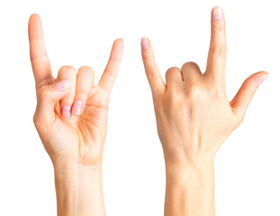 Set of women's hands showing rock n roll sign or giving the devil horns gesture