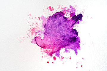 watercolor stain on paper red purple with droplets of paint, bright on the texture of watercolor paper.