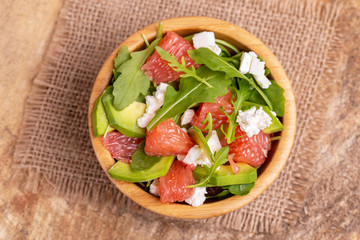 Tasty salad with grapefruit, spinach, feta, avocado and pomegranate