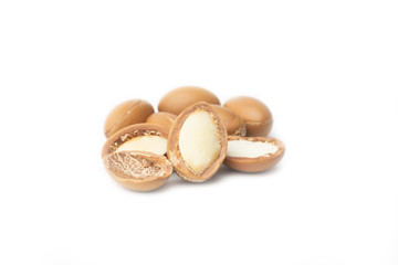 Fototapeta na wymiar ARGAN SEEDS isolated on a white background. Argan oil and argan nuts concept