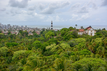 Fototapeta na wymiar Aerial view of Olinda Lighthouse and Church of Our Lady of Grace, Catholic Church built in 1551, surounded by palms, Olinda, Pernambuco, Brazil