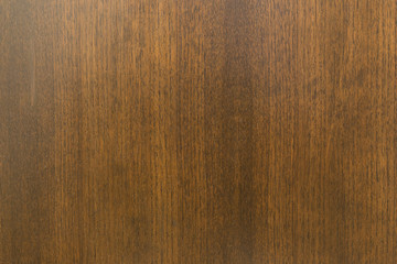 Full frame background of an aged and dusty brown wood board wall. Material used in cupboard, closet, furniture or door.