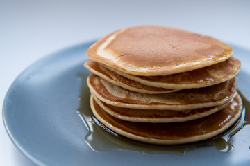 Sweet homemade stack of pancakes with maple syrup for breakfast
