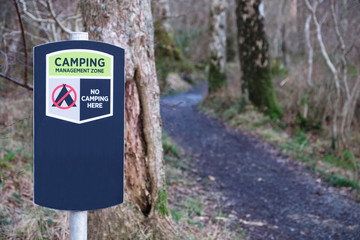 Fototapeta na wymiar Camping restriction zone not allowed sign in countryside private land