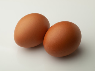 Two eggs isolated on white background
