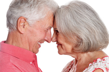 Portrait of happy senior couple on white background