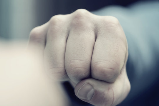 male hand punch, aggression and violence