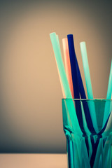 Straws in a blue glass