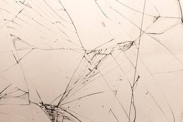 Broken glass on a light yellow background, texture background texture object