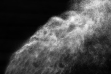 A stream of water and a cloud of drops