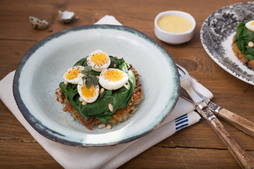 Quail Eggs florentine with spinach and rosti
