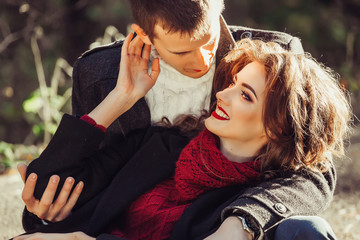 Young happy couple in love hugging outdoors. Tender, romantic, relationships concept