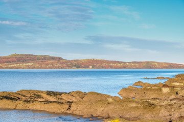 Fototapeta na wymiar Little Cumbrae from Portencross North Ayrshire on a Cold Day in Scotland.