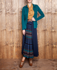 Women's jacket, blouse, coat, skirt and photomodel posing. Wooden floor. Fashion and design, luxury. Dark colored and patterned dress. Islamic fashion - Image